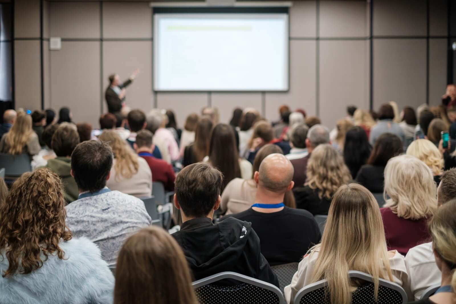 Audience attending a CUI compliance training seminar